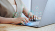 © Tanakorn - Businesswoman using laptop with virtual AI human resources dashboard and workflow icons. Concept of HR automation, smart recruiting strategy, digital employee management, and workforce analytics.