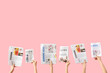 © Pixel-Shot - Women with newspapers on pink background
