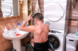 © Alex - A man in a wheelchair combs his hair after taking a shower