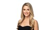 © Shamim Akhtar - A smiling woman with long blonde hair wearing a black strapless top isolated on white background