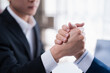 © Tj - Two business people are making a strong, firm handshake, representing a commitment to partnership, a new deal, agreement, and successful cooperation in a professional setting