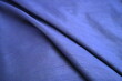 © D Studio - Soft folds of luxurious blue fabric texture