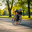© Rahima - Paraplegic Man Kneeling on Road with Bicycle in Park