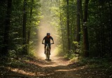 A rider navigates a rugged dirt path through a dense forest canopy. The intense athletic activity highlights outdoor adventure and fitness goals ,equipment ,dirt ,gear