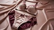 © Kavindu - Elegant satin lingerie set in pink and red, styled on silky fabric with soft lighting, luxurious intimate fashion