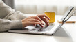 © Pavel - Close-up of woman's hands typing on a laptop at home, working on email, business report, data entry, research, and remote communication for company tasks.