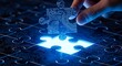 © Mst - Close-up of a hand placing a glowing blue puzzle piece with circuit board patterns into a matching slot, symbolizing technology solutions