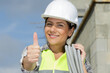 © auremar - female construction worker with thumbs up