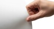 © Adi - Close-up of a person's hand gently holding a blank white piece of paper against a white background, highlighting the texture and surface