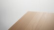 © VolumeThings - Top-down perspective of an empty wooden table corner on a white background with a clipping path