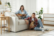 © New Africa - Couple with cute dog relaxing at home