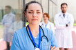 © StockMe - Medical care team with serious expression standing with a nurse in the foreground, showing teamwork and the concept of the medical profession