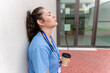 © StockMe - Healthcare professional experiencing workplace burnout, tired and stressed nurse, taking a coffee break