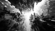 © Thawatchai - Architectural Abstraction: A captivating perspective of an abstract urban landscape, a monochromatic depiction of a futuristic city with towering structures and an inviting celestial aperture.