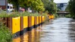 © Kingboy - Flood Barrier Deployment Along Riverbank to Protect City from Rising Waters