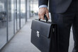 © photostocktrend - Hand Holding Briefcase in Business Concept