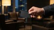 © Hypnyo - Hand holding blank black business card presenting it in a luxury office lounge at night with copy space for design mockup for exclusive professional networking concept.