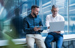 © BusinessClass by W61 - Business team collaborating on digital data analysis in modern office