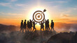 © David Zarzosa - Business team achieving goal and success at mountain summit with target symbol at sunrise.