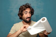 © kues1 - young adult bearded man with a paper towel roll