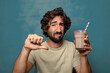 © kues1 - young adult bearded man with a chocolate milkshake