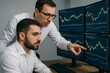 © diproduction - Two businessmen analyzing financial stock data on multiple monitors in office setting focused on trading strategy and investment planning discussions. Ai generative