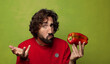 © kues1 - young adult bearded man with a red pepper