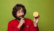 © kues1 - young adult bearded man with an orange