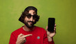 © kues1 - young adult bearded man with a smart phone