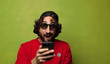 © kues1 - young adult bearded man with a smart phone