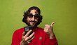 © kues1 - young adult bearded man with a smart phone