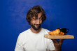 © kues1 - young adult bearded man with a french breakfast