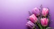 © Jubaidul Islam - Elegant bouquet of pink tulips and purple lavender flowers on lilac background symbolizes spring beauty and floral decoration for greeting cards or seasonal promotions with copy space for text