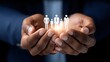 © lililia - Businessman holds social network icon with people, symbolizing human resources and online support on dark background