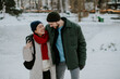 © BGStock72 - Winter stroll in the park with a couple enjoying the snow