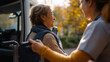 © Kateryna - Nurse helping senior person in wheelchair from vehicle, healthcare professional assisting with transportation exit, elderly care with mobility support on autumn day, medical assist