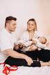 © DSMT - Cherished family moments reflect a couples love as they welcome their newborn. They embrace parenthood, creating lasting memories filled with laughter and tenderness, strengthening their bond
