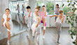 © JackF - Group of teenagers learn to dance hip-hop and other modern dances in a spacious dance studio