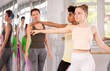 © JackF - Slim adolescent female and male attendees of ballet courses training ballet in pair during workout session