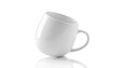 © MdTanvir - A white ceramic mug on a reflective surface