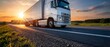 © ON - Studio - White semi truck driving on a highway at sunset. Heavy cargo vehicle transporting goods on a country road with motion blur. Logistics and delivery concept