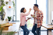 © sofiko14 - A loving couple enjoys a healthy meal together in their bright, modern kitchen