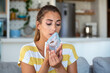 © Graphicroyalty - Young woman holding nebulizer mask for breathing treatment. Respiratory illness, asthma and oxygen therapy concept. Sick female patient using inhalation mask to relieve chest congestion.
