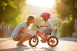 © Tatiana - Mother teaching child riding bicycle outdoors at sunset