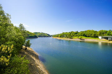 Naklejka na meble View of the Wuppertal Dam and the surrounding countryside. Landscape by the lake near Remscheid in the Bergisches Land region.
