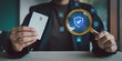© HappyEva - Businessman hand holding credit card and magnifying glass detecting virtual fraud warning sign on security shield for financial risk management concept, Security Analysis Investigation, Verified Safe