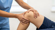 © Sabbir9003 - Physical therapist examining a patient's knee