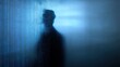 © NingPhattraphorn - A shadowy figure is seen against a backdrop of binary code, technology, data, and the digital world, blurred AI binary screen wall
