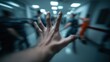 © NingPhattraphorn - a frightening scene of people escaping with a hand trying to reach for help against blurred hallway background