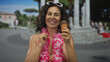 © Krakenimages.com - Middle age woman in bikini wearing lei hand shows ok sign while holding ice cream cone in plaza; approval fun.
